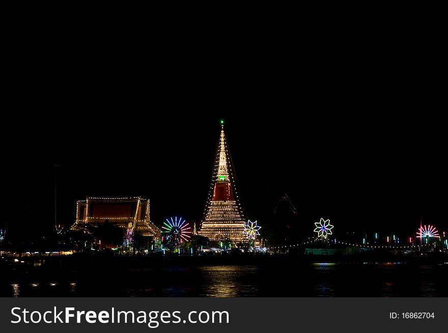 The temple Phra Samut Chedi in Samut Prakan, Thailand, decorated during a temple festival. The light reflected in the Chao Praya River. The temple Phra Samut Chedi in Samut Prakan, Thailand, decorated during a temple festival. The light reflected in the Chao Praya River.