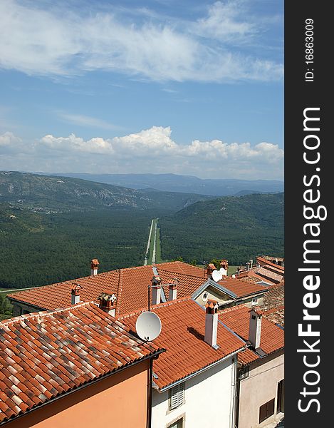 View of the house with red roofs and the valley from a high point. The town of Motovun, Croatia