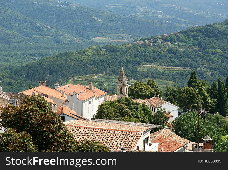 View of the house with red roofs and the valley from a high point. The town of Motovun, Croatia