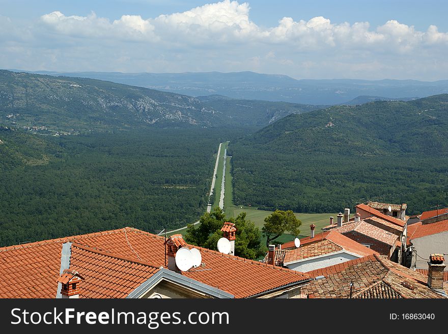 View of the house with red roofs and the valley from a high point. The town of Motovun, Croatia