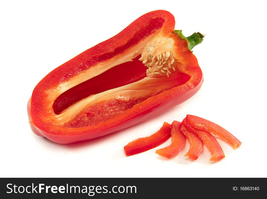 Opened red bell pepper and slices on white background
