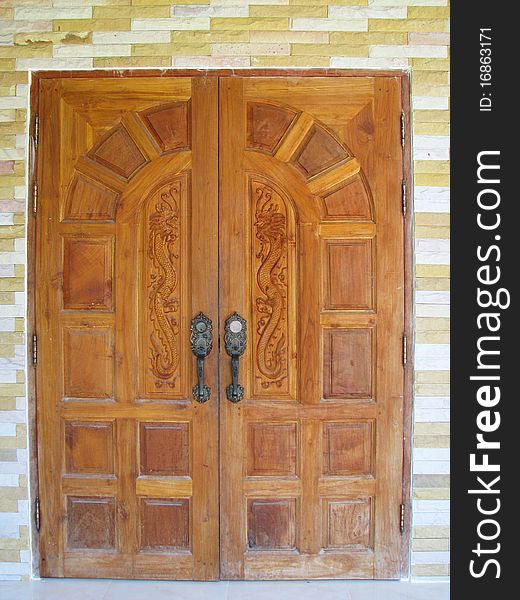 King of Nagas design on brown door of house