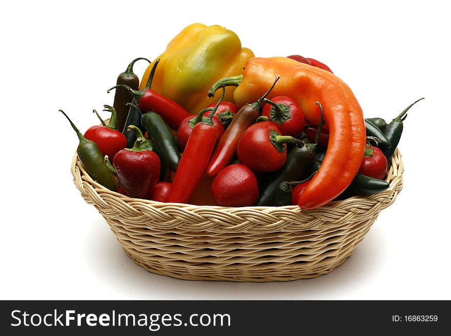 A collection of peppers in a wicker basket