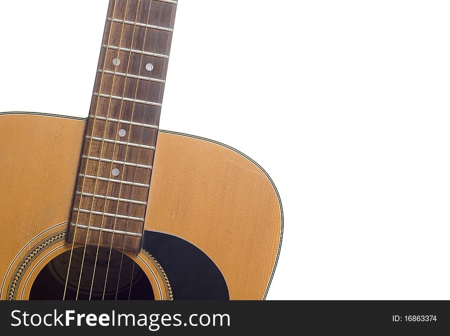 An Acoustic guitar on a white background. An Acoustic guitar on a white background