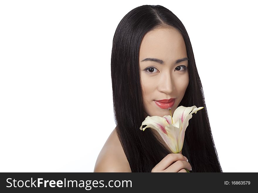 Chinese girl with lily in her hand isolated on white