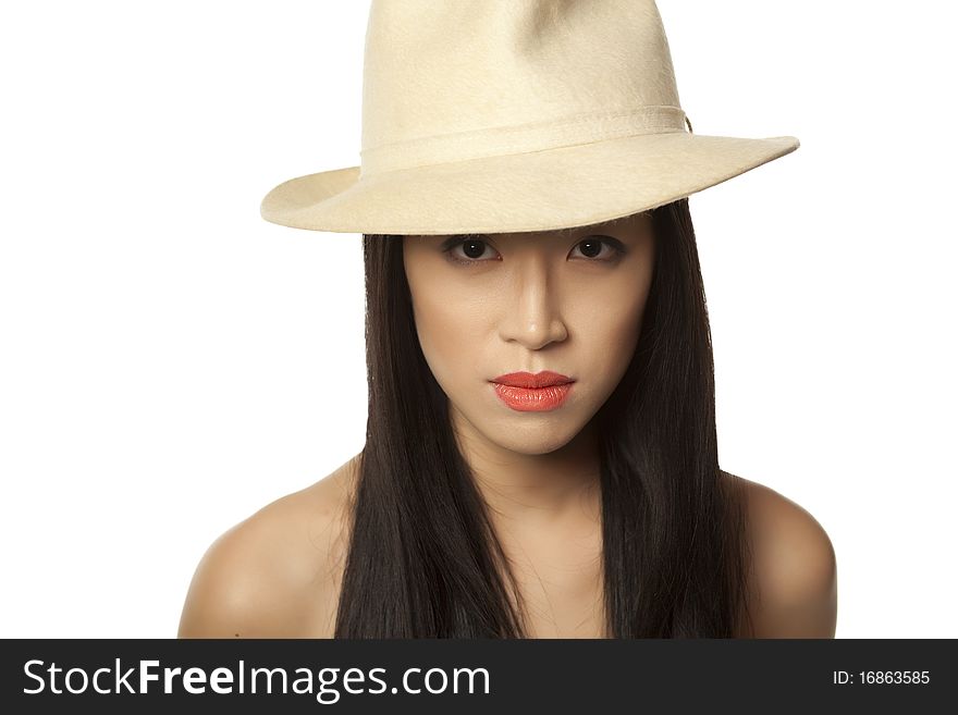 Beautiful chinese girl with long hair on the white background with white hat. Beautiful chinese girl with long hair on the white background with white hat