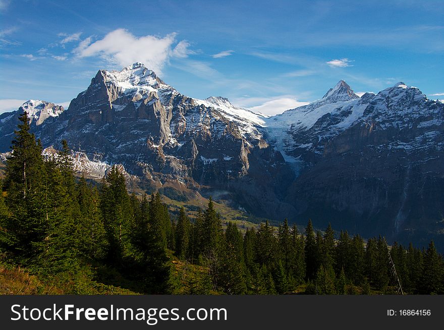 Mountain landscape with snowy Jungfrau peaks in Swiss Alps. Taken in November 2010. Mountain landscape with snowy Jungfrau peaks in Swiss Alps. Taken in November 2010.