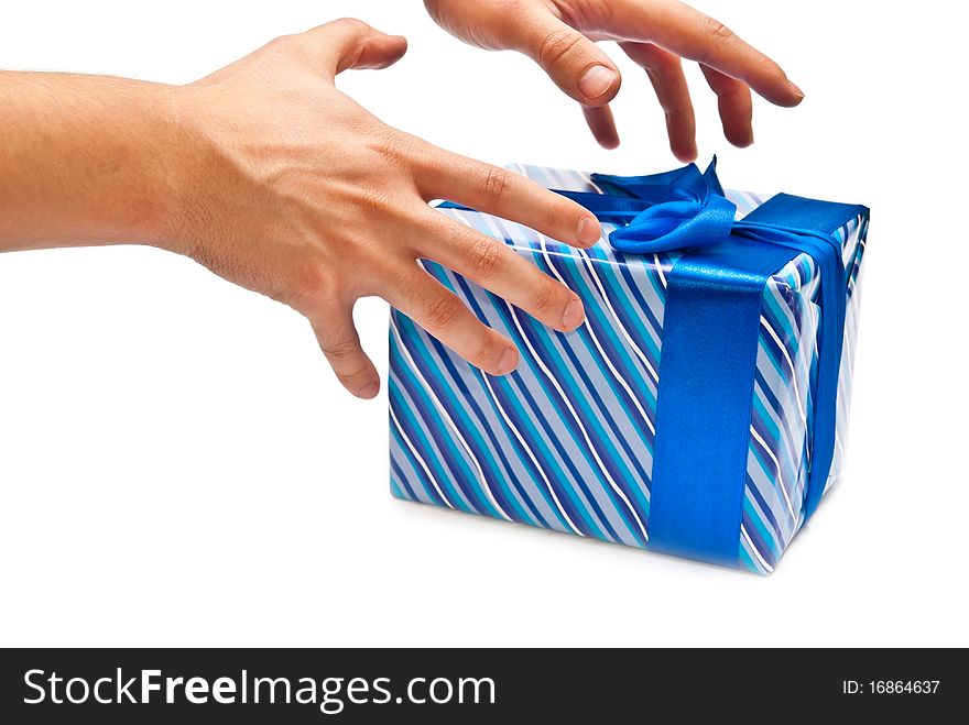 Blue gift box with bow and man's hands. Isolated on white. Blue gift box with bow and man's hands. Isolated on white