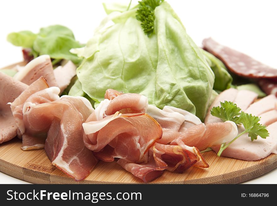 Raw ham with salad and parsley
