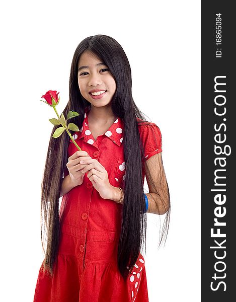 Beautiful asian teenager holding a rose, isolated on white background