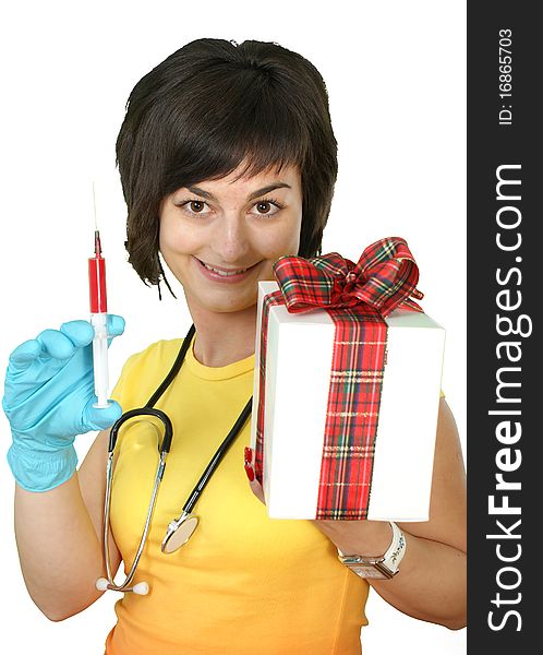 Medical doctor with syringe and gift box on white background