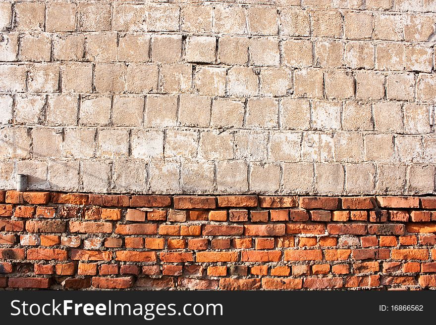 Red vintage brick and concrete wall background. Red vintage brick and concrete wall background