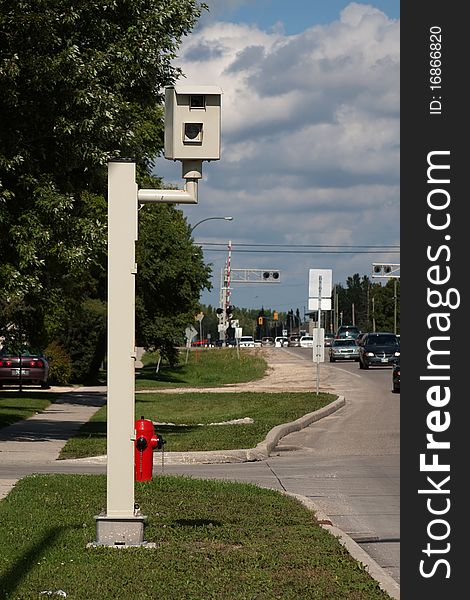 Photo radar traffic camera showing traffic and sky in background