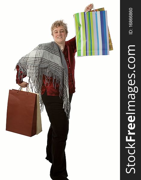 Middle age short hair blond woman holding several shopping bags. Middle age short hair blond woman holding several shopping bags