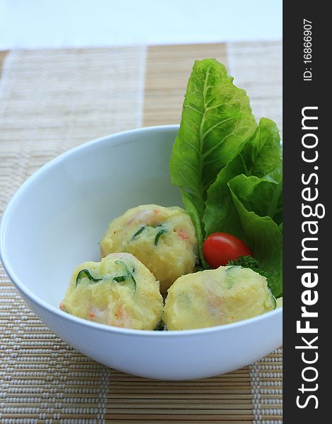 Potato salad balls mixed shrimp background bamboo sheet. Potato salad balls mixed shrimp background bamboo sheet