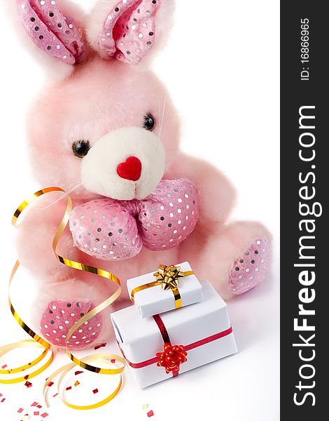 Toy pink rabbit with gifts