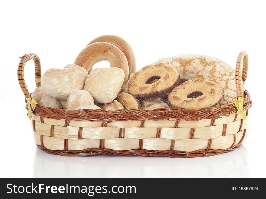 Wattled basket with sweets on a white background