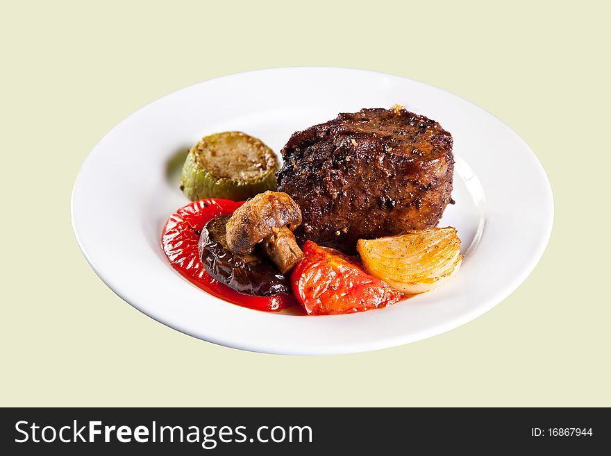 Roast pork with grilled vegetables. Isolated.