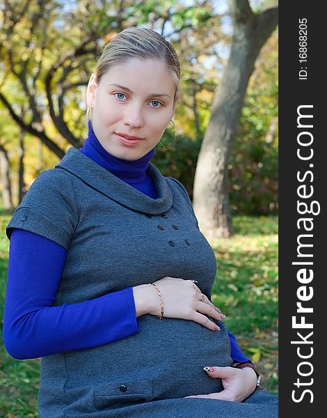Beautiful pregnant woman in the park. Beautiful pregnant woman in the park