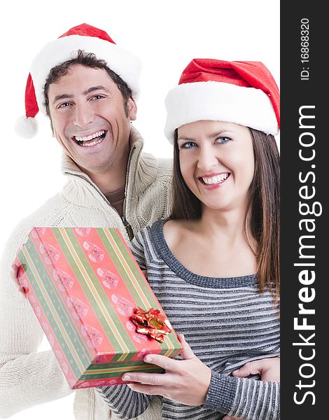 Happy couple holding a Christmas gift. Happy couple holding a Christmas gift