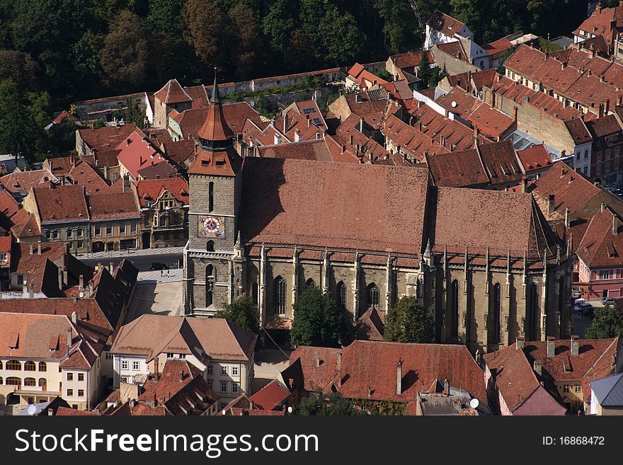 An aerial view of the massive centuries old 'Black Church' in the historic center of Brasov city, Romania. An aerial view of the massive centuries old 'Black Church' in the historic center of Brasov city, Romania.