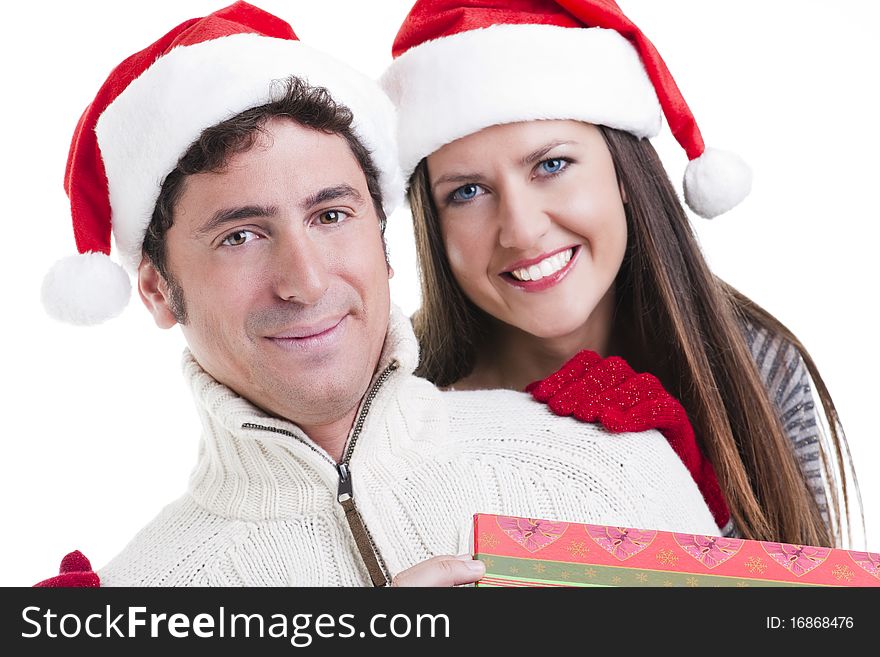 Happy couple holding a Christmas gift. Happy couple holding a Christmas gift