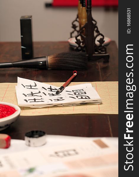 Traditional asian calligraphy set on wooden table. Traditional asian calligraphy set on wooden table