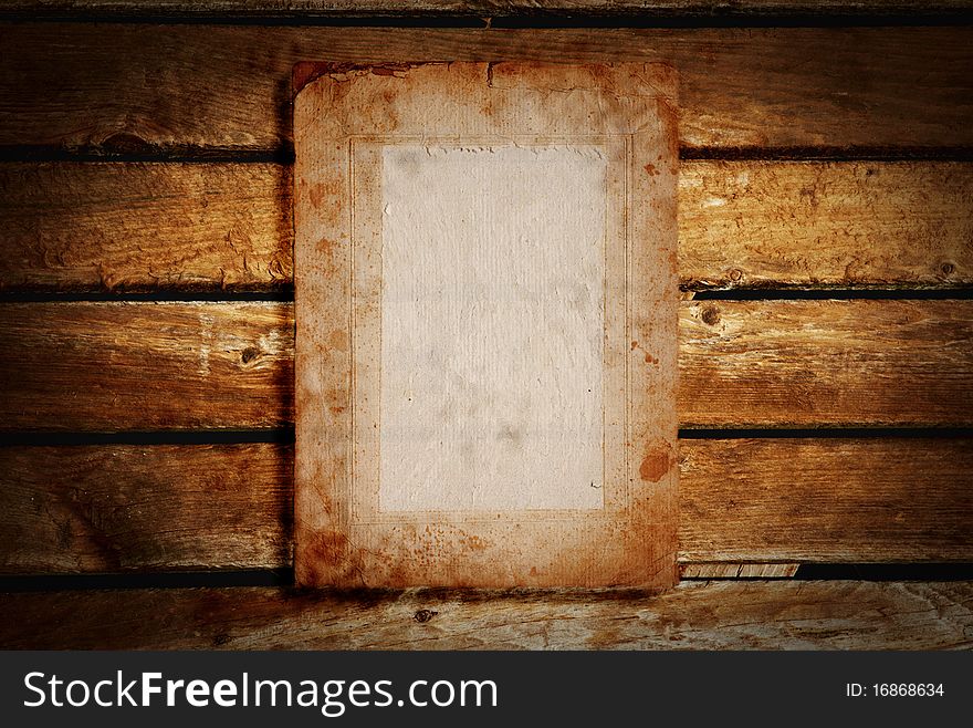 A old paper on wooden desks as a background or texture on white