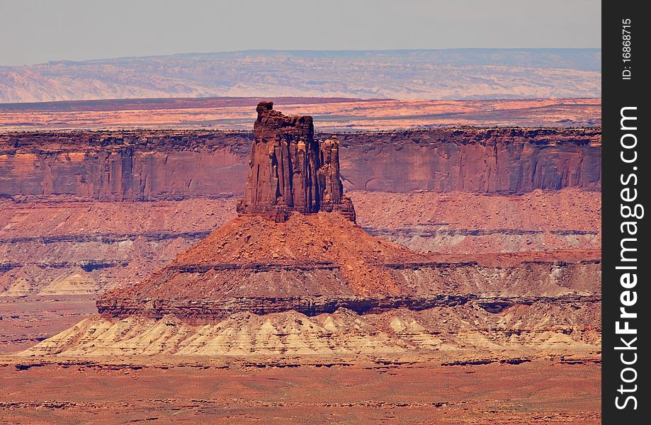 Looking out over Canyonlands National park in Utah, USA with massive rock formation in the valley floor