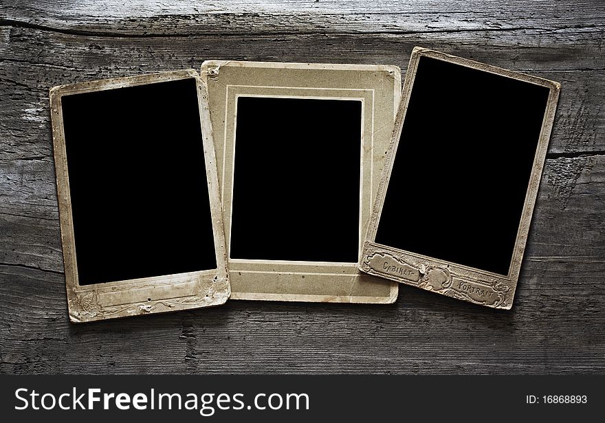 Antique photo frame on wooden background. Antique photo frame on wooden background