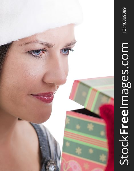 Happy young woman opening a Christmas present. Happy young woman opening a Christmas present