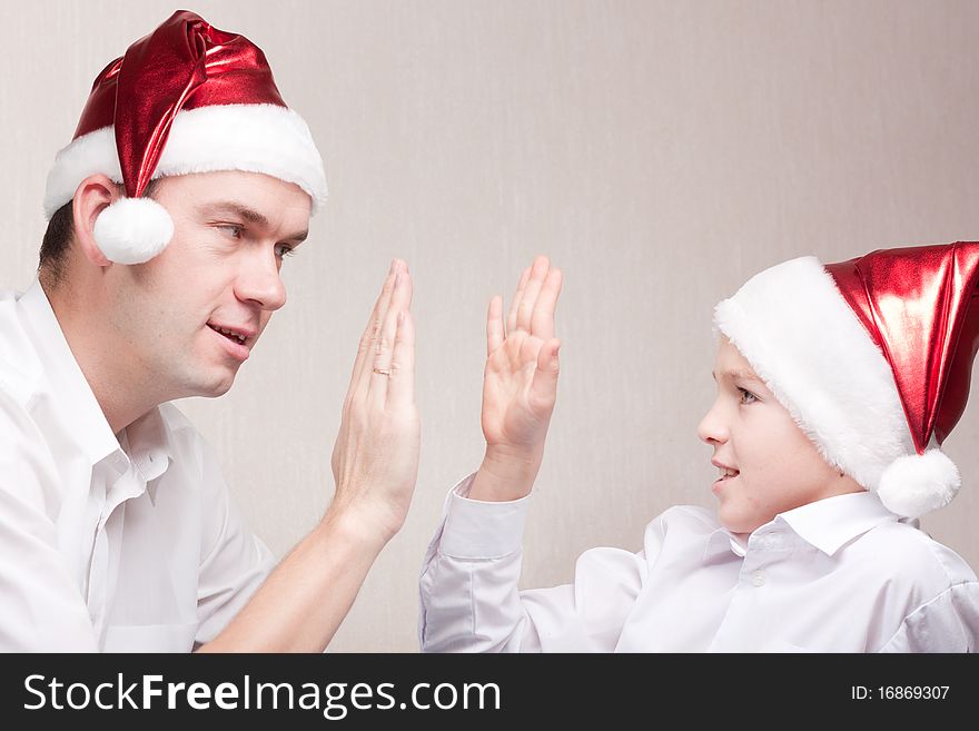 Happy Teen And Man In Santa Hat