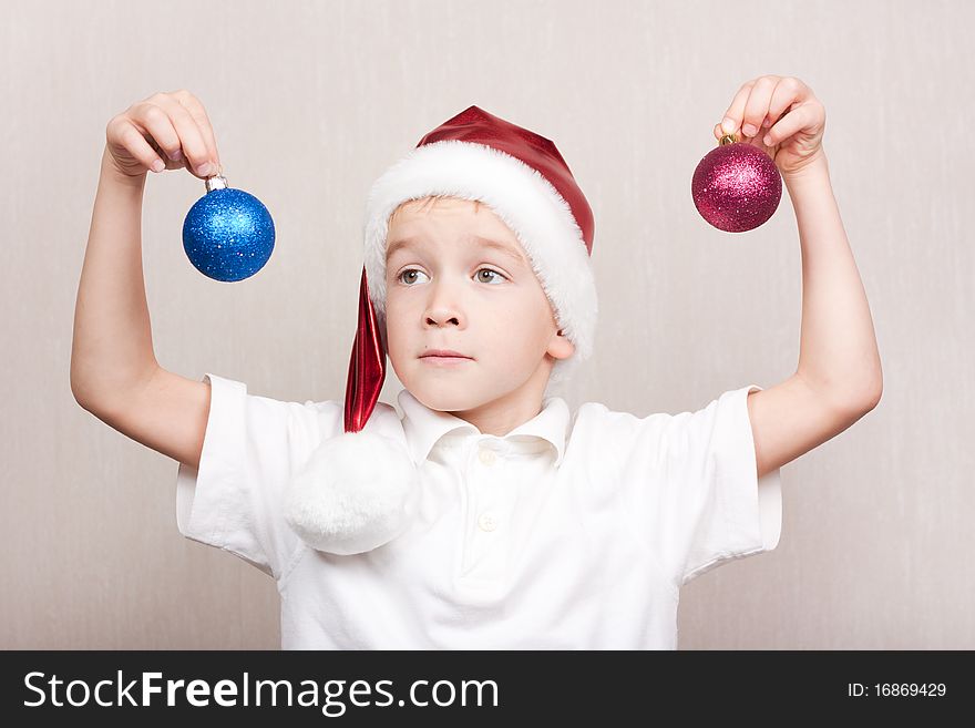 Little boy in red christmas hat