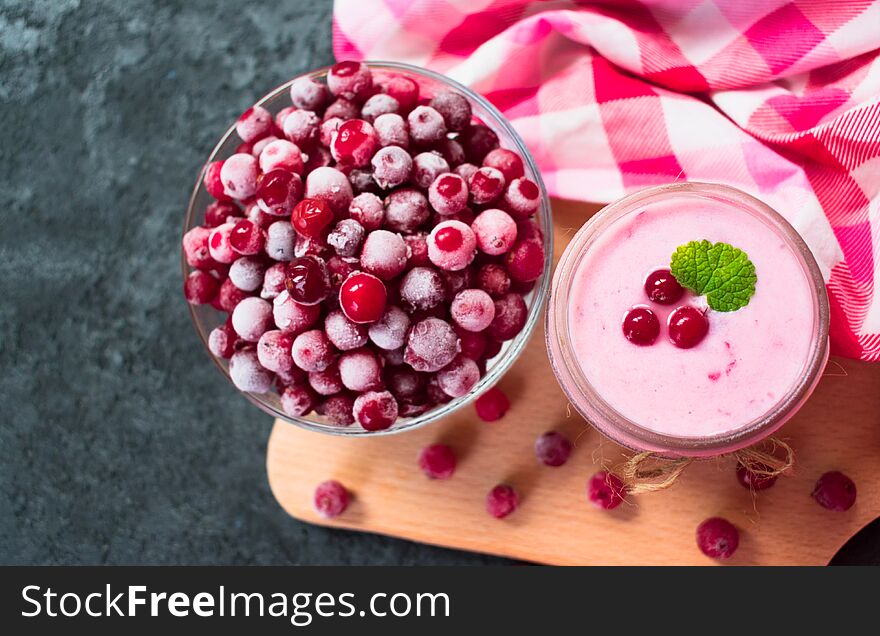 Frozen cranberry yogurt on a black background. The concept of healthy desserts. Top view.