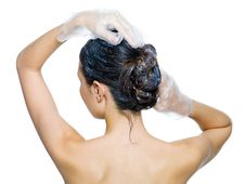Rear View Of Woman Dyeing Hairs Stock Images