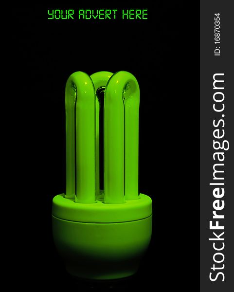 Picture of a flourescent green glowing low energy bulb, eco friendly product on a black background. Picture of a flourescent green glowing low energy bulb, eco friendly product on a black background.