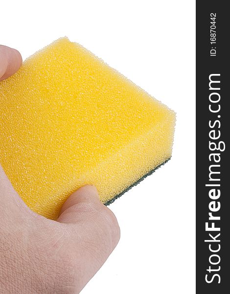 Yellow synthetic sponge for cleaning the men's hand.