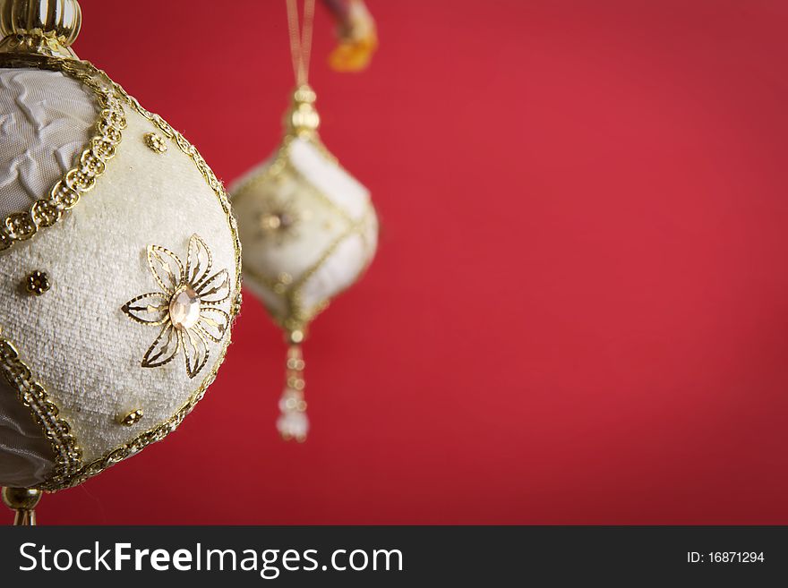 Gold and white christmas balls on red background,. Gold and white christmas balls on red background,