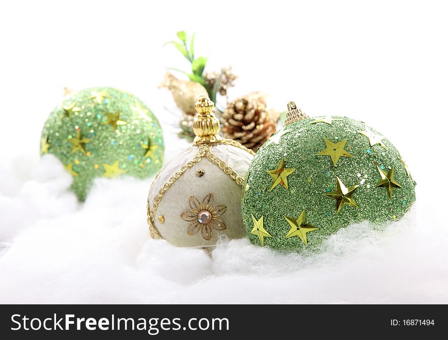 Decorated christmas balls over cotton and white background