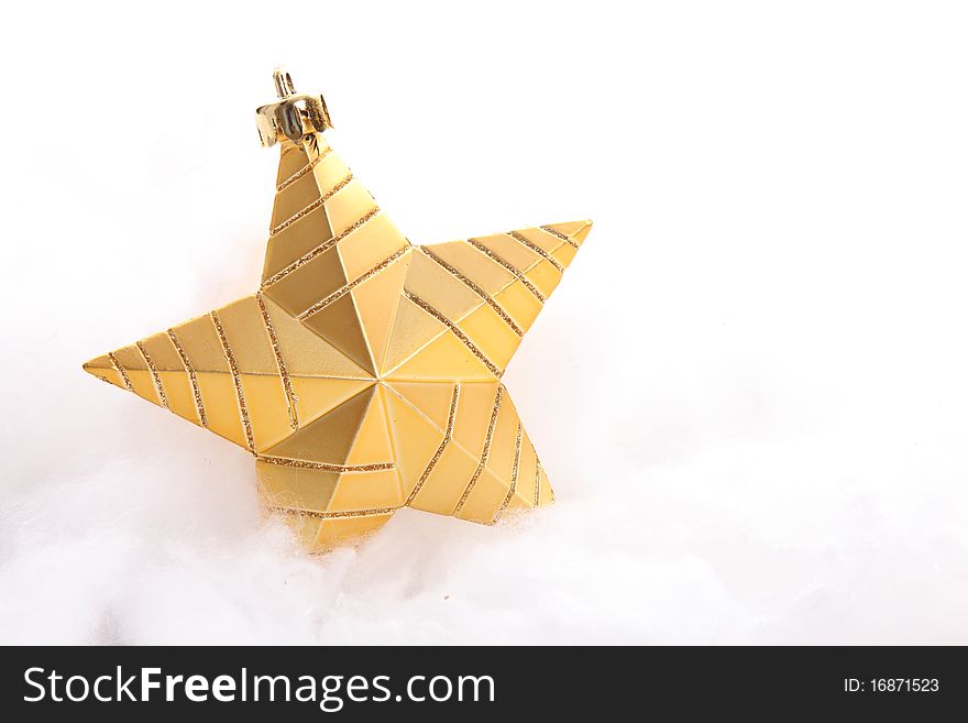 Gold star over cotton balls and white background