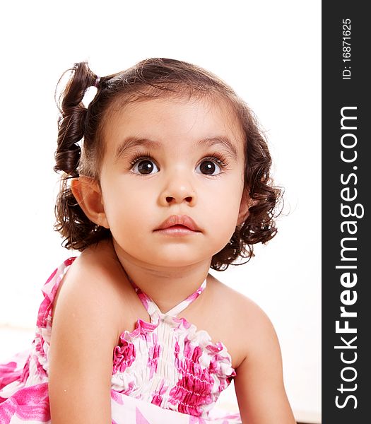 Little girl looking up on white background