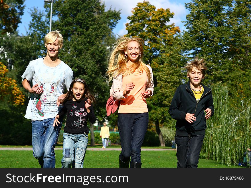 Happy family have fun and stroll in park. Happy family have fun and stroll in park