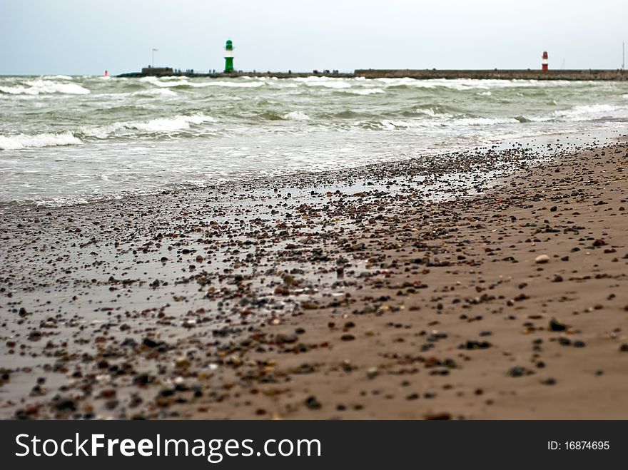 Sandy beach with two lighthouses in the background. Sandy beach with two lighthouses in the background