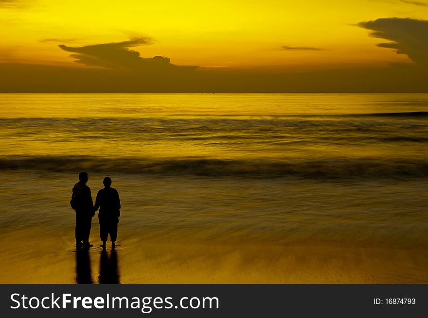 Father and son having intimacy at a local beach. Father and son having intimacy at a local beach