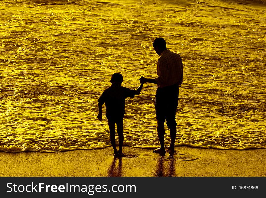 Father and son having intimacy at a local beach. Father and son having intimacy at a local beach