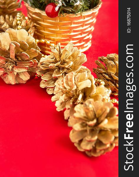 Decoration for the Christmas tree with a gilt on a red background. Decoration for the Christmas tree with a gilt on a red background