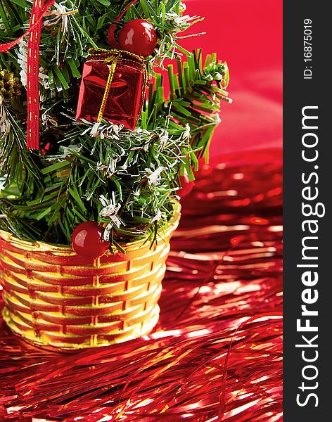 The decorative Christmas tree is in a basket