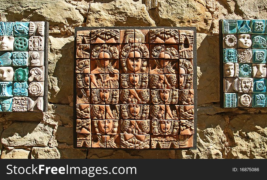 Ceramic panels depicting people s heads