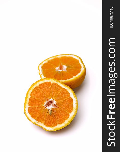 Orange fruit cut in half isolated on white background. Orange fruit cut in half isolated on white background