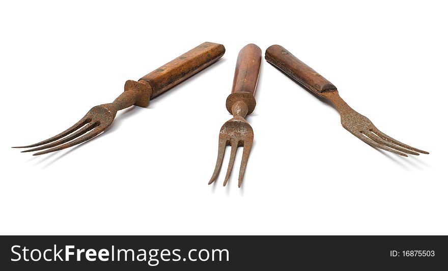 Three old rusty fork on a white background. Three old rusty fork on a white background.